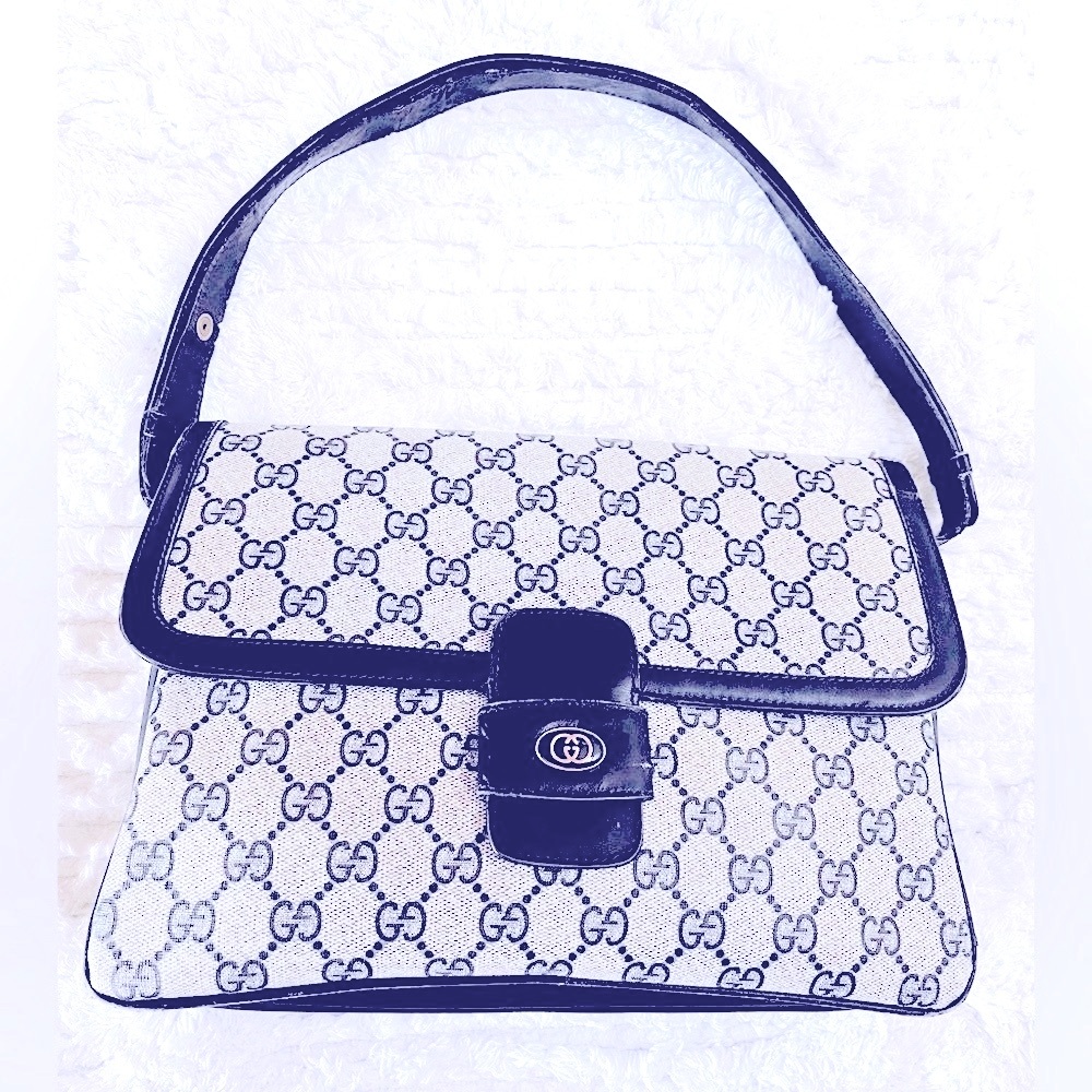 Rare Gucci shoulder bag. Authentic. Navy coated canvas gg mono. Leather trim.GUC